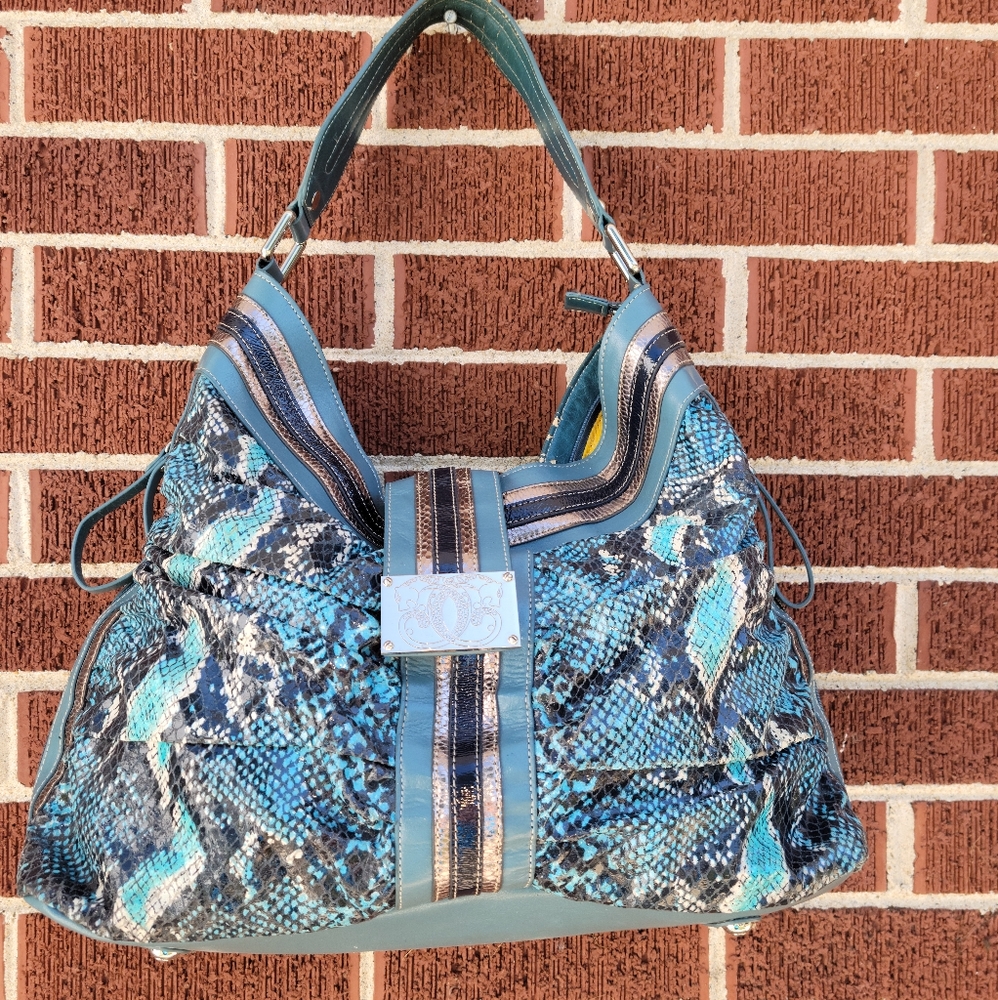Sharif snake skin, leather, man made material bag.